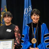 four people up on stage